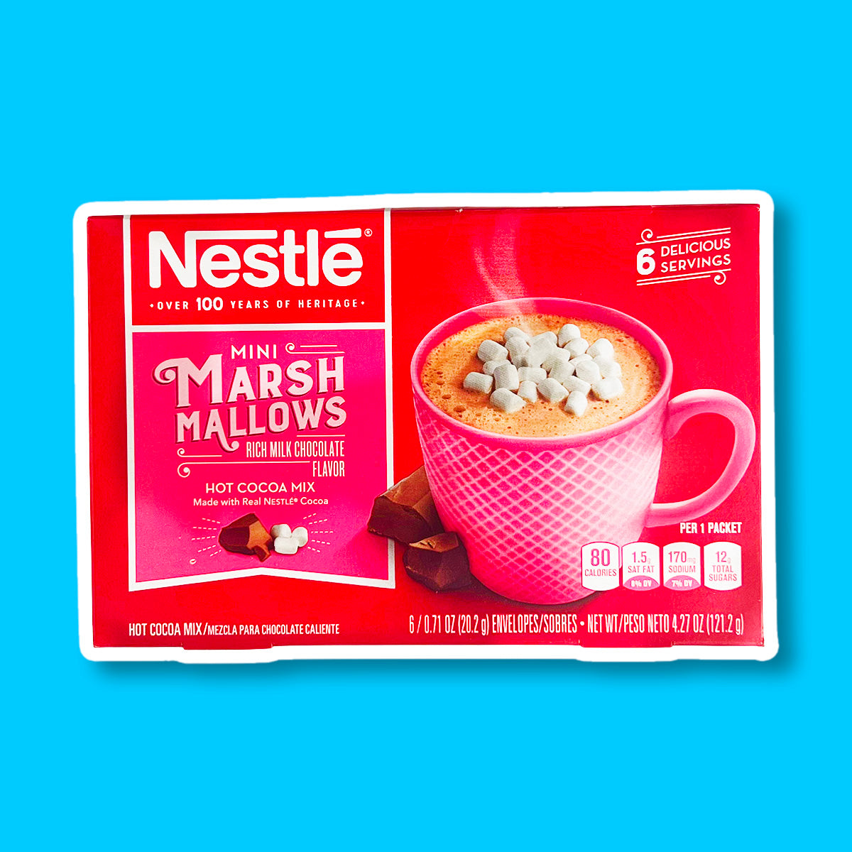 Un carton rouge sur fond bleu avec une tasse rose remplie d’une boisson chaude brune avec au-dessus des mini marshmallows. A gauche 2 morceaux de chocolat 