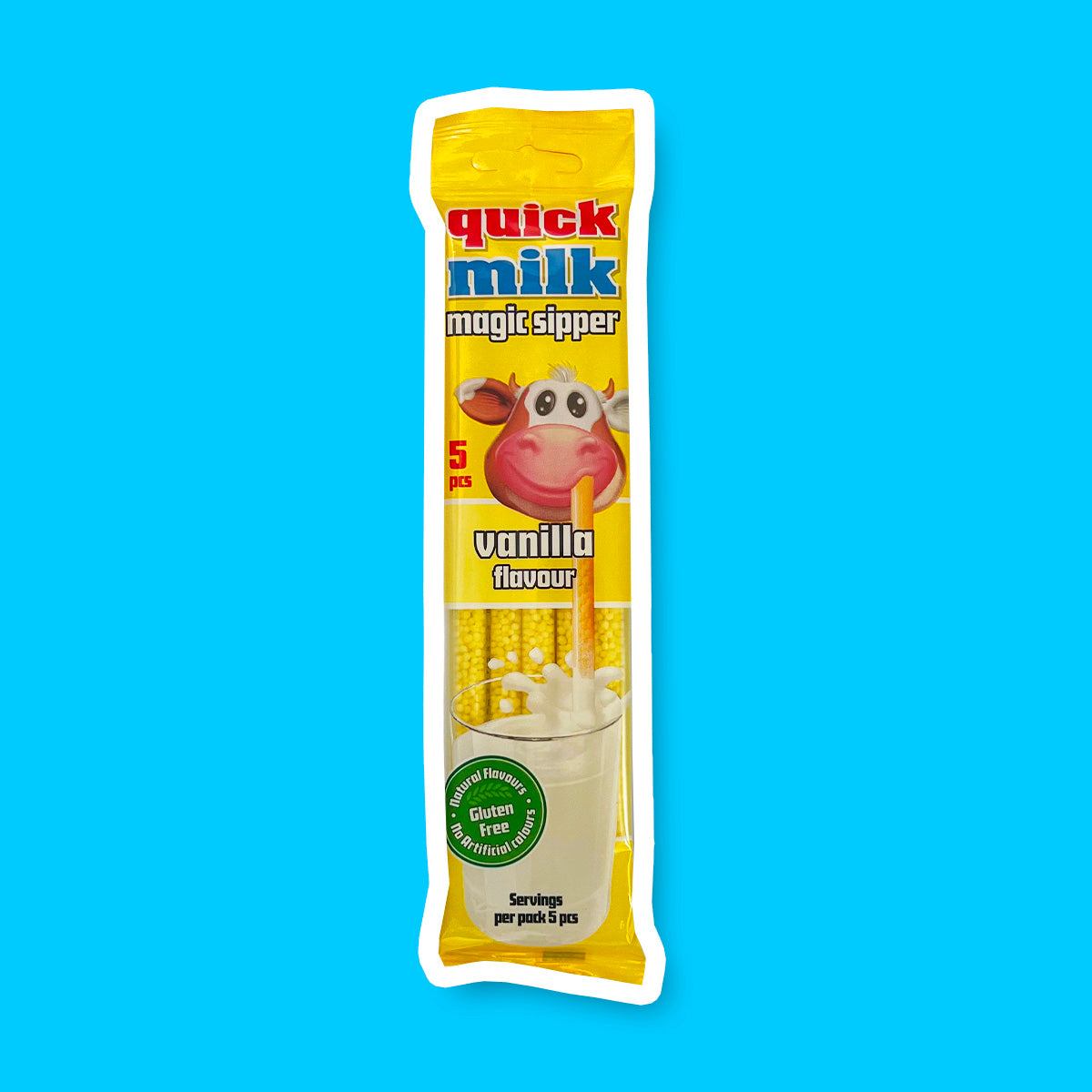 Un paquet jaune sur fond bleu avec un verre de lait et une paille Quick Milk à la vanille dans la bouche d’une vache. Il y a une partie transparente qui dévoile les pailles 
