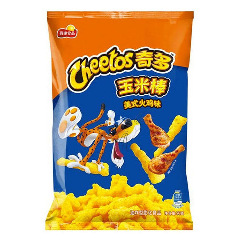 Un paquet orange et bleu avec en bas des chips allongés jaunes et un tigre qui veut manger des cuisses de poulet. Le tout sur un fond blanc