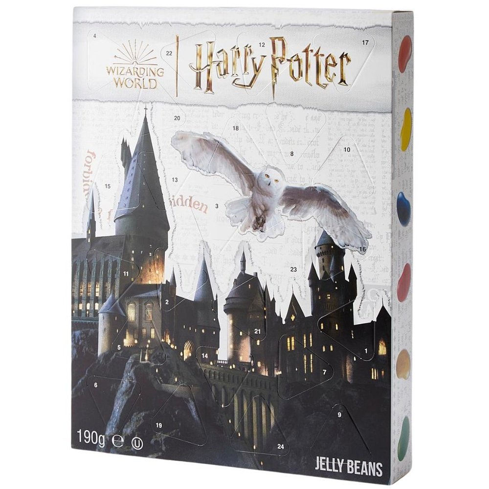 Un carton rectangulaire blanc avec le château de Poudlard sombre et la chouette Hedwige d’Harry Potter qui vole, le tout sur fond blanc