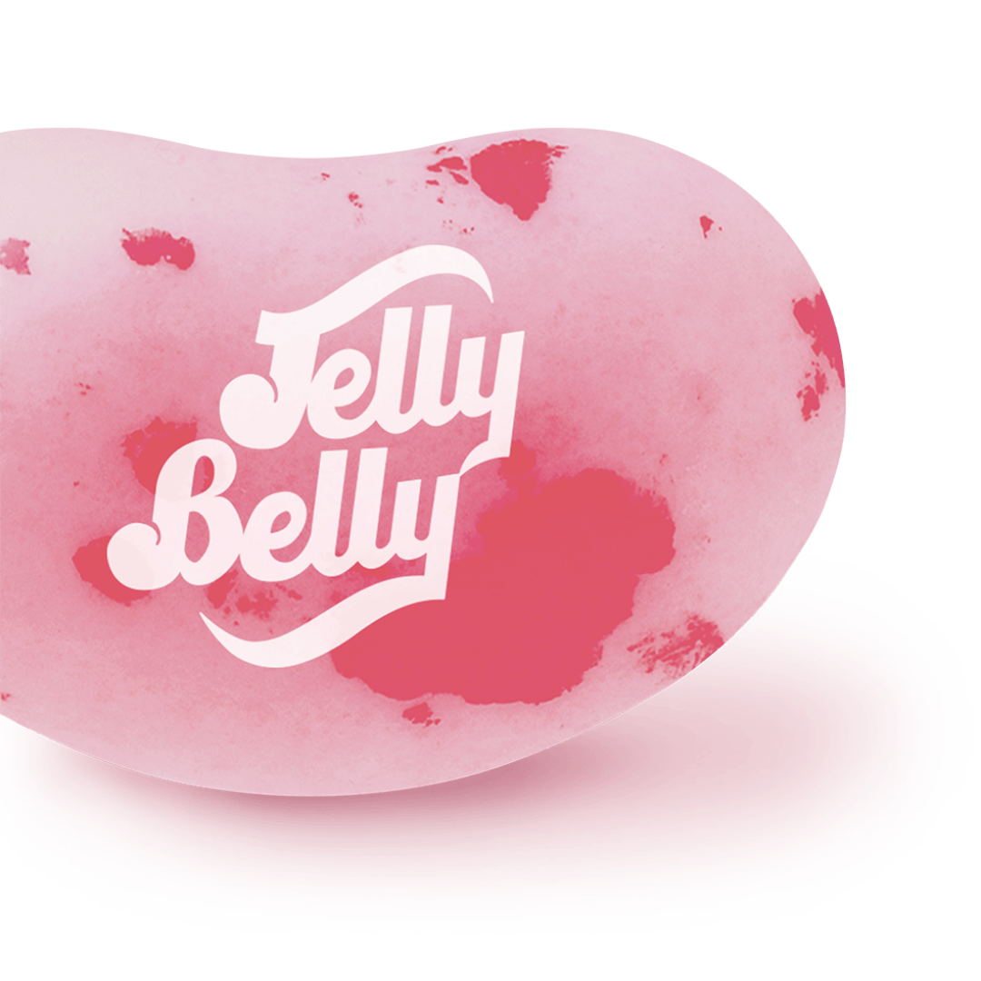 La partie d'un Jelly Belly rose avec des tâches rouges, le tout sur fond blanc