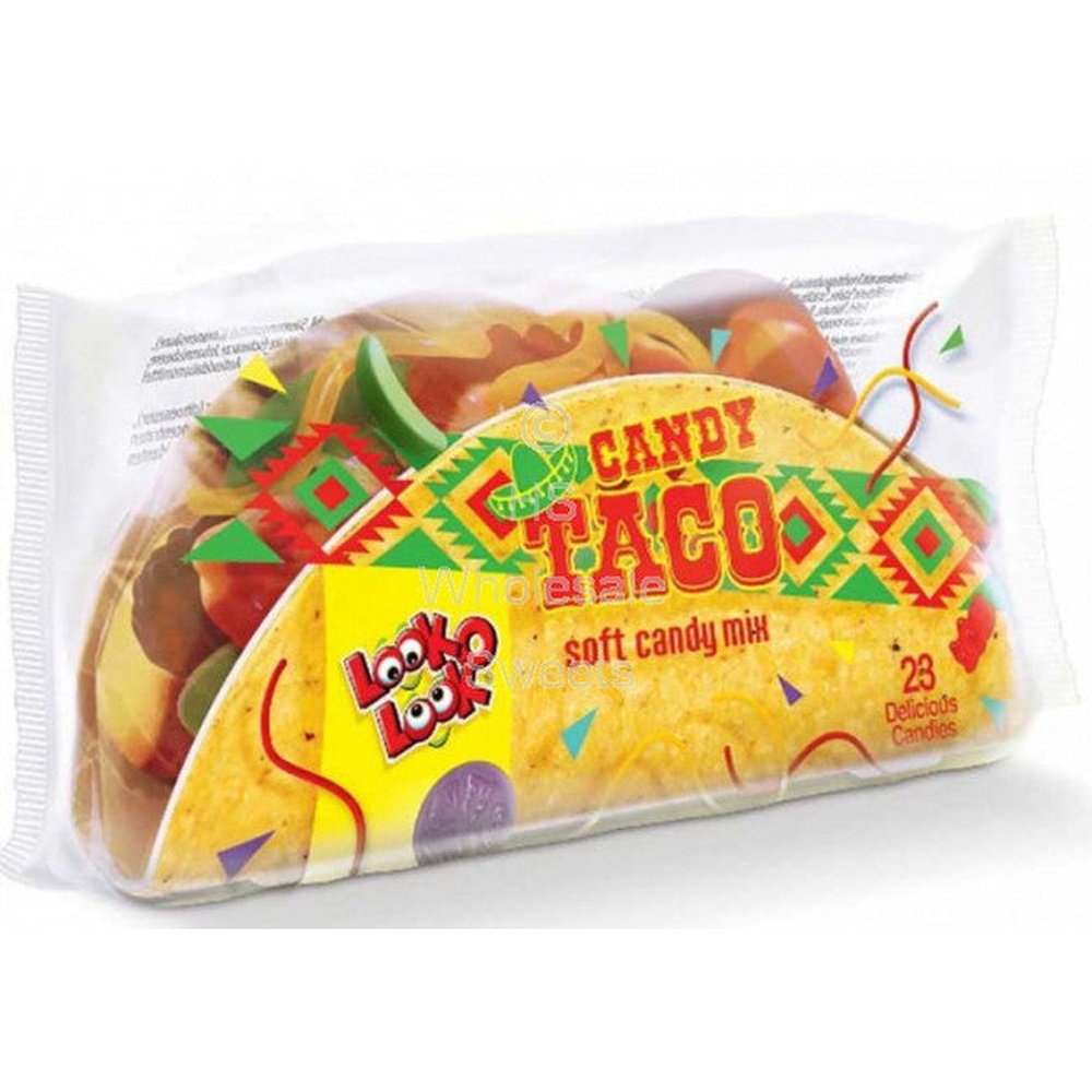 Un emballage transparent avec un papier en forme de tacos et à l’intérieur il y a plusieurs bonbons colorés, le tout sur fond blanc 
