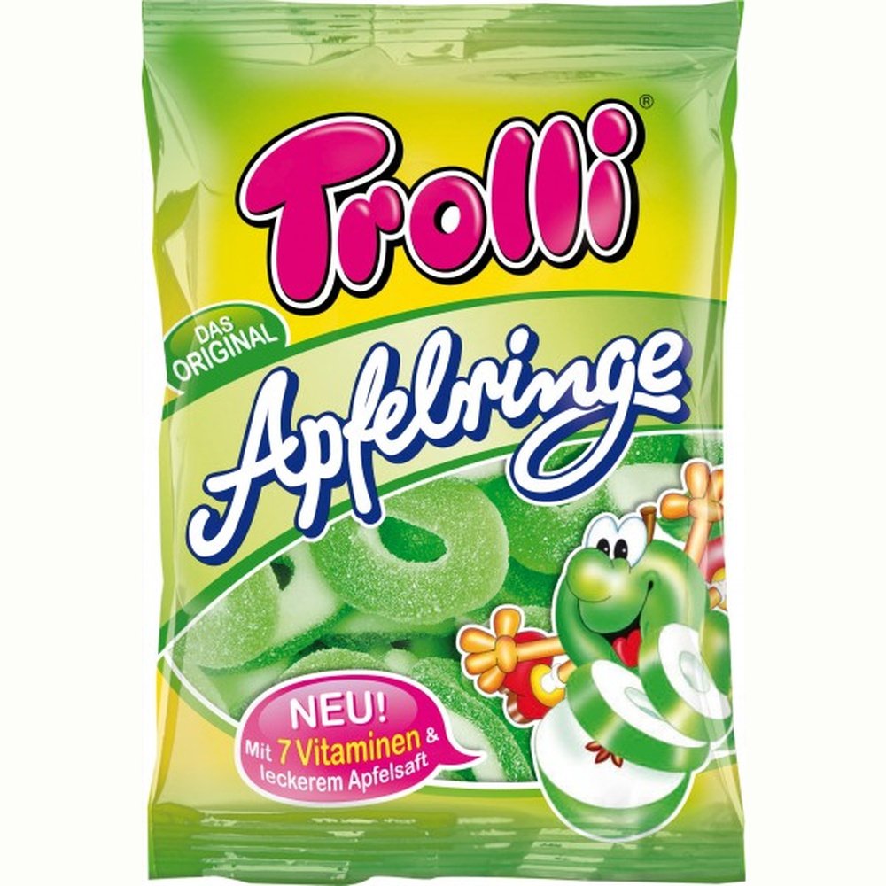 Un emballage vert sur fond blanc avec un personnage en pomme et en bas il y a une partie transparente où on voit des bonbons en anneaux verts